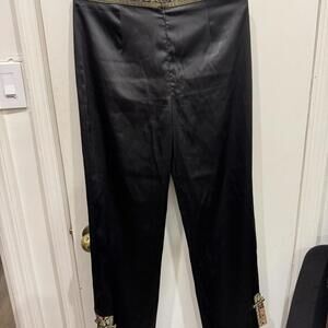 Black silk pants with multi-coloured floral patches #floral